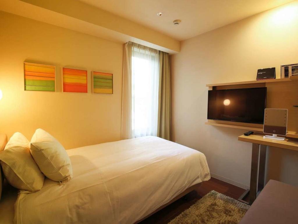 TV a/nebo společenská místnost v ubytování Hotel Resol Ikebukuro