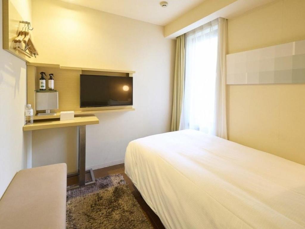 TV a/nebo společenská místnost v ubytování Hotel Resol Ikebukuro