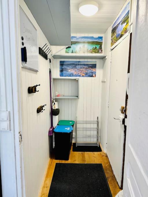 a small room with a toilet in a tiny house at Appart. spacieux et lumineux 4 pers. in Morez