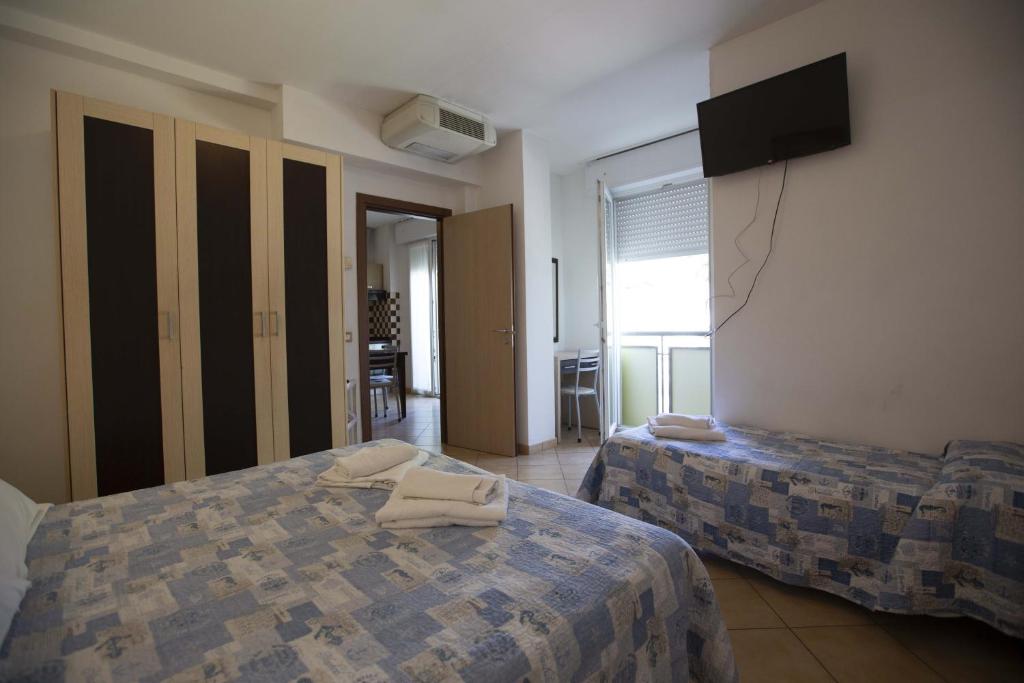 Łóżko lub łóżka w pokoju w obiekcie Residence Eurogarden