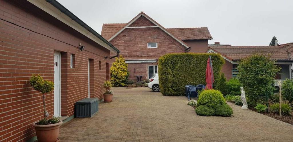 a driveway of a house with a car parked in it at Ferienhaus Anna in Neuendorf