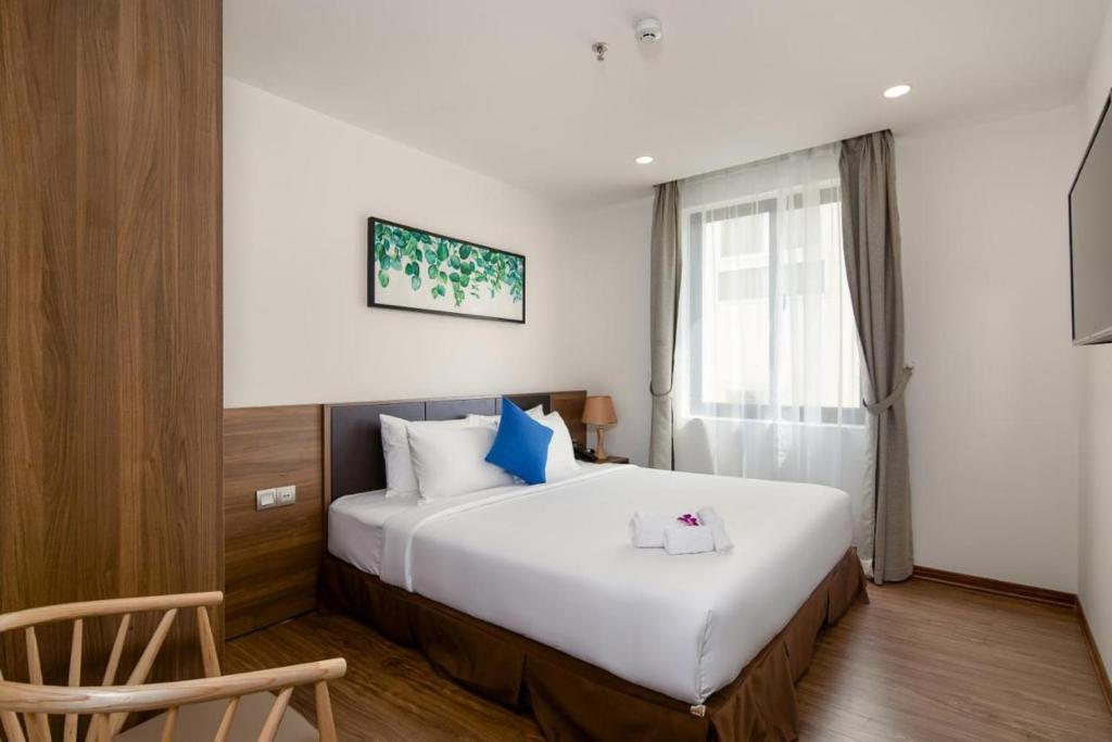 Postel nebo postele na pokoji v ubytování Amunra Ocean Hotel