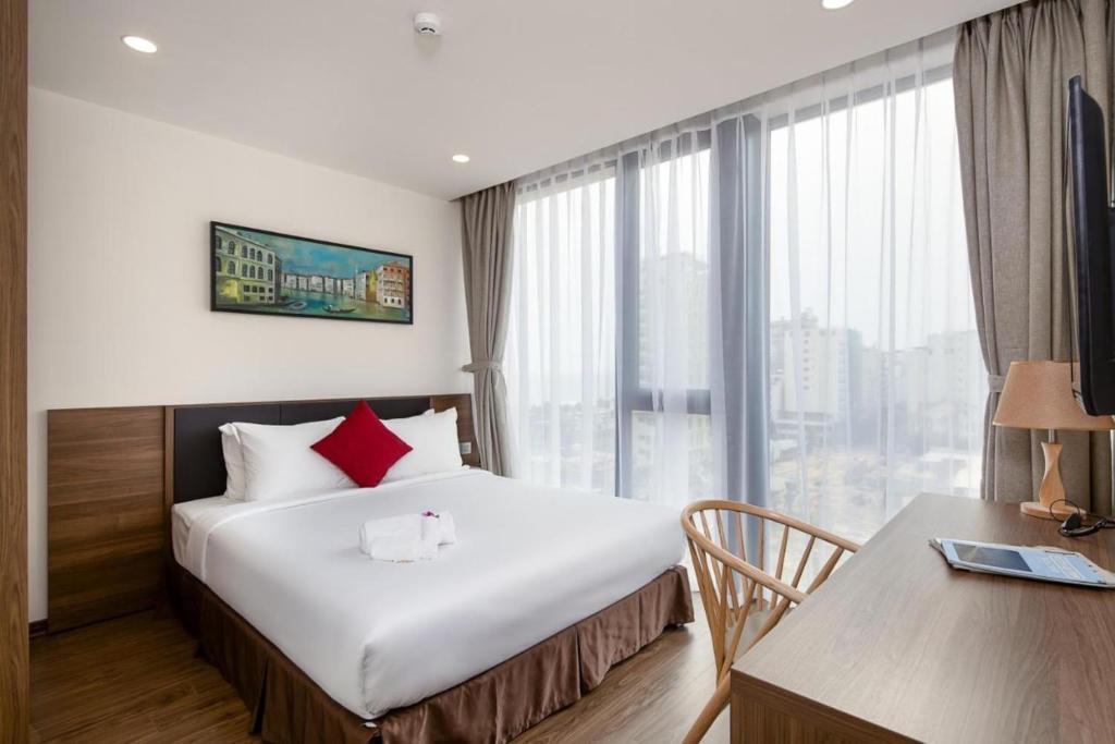 Postel nebo postele na pokoji v ubytování Amunra Ocean Hotel