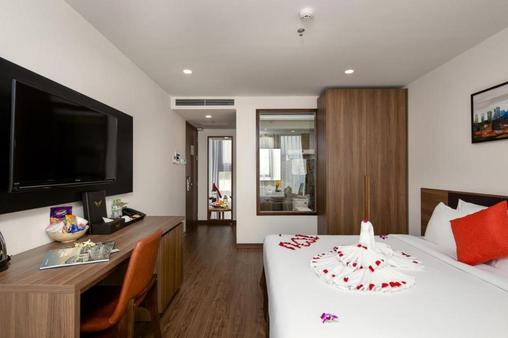 Postel nebo postele na pokoji v ubytování Amunra Ocean Hotel