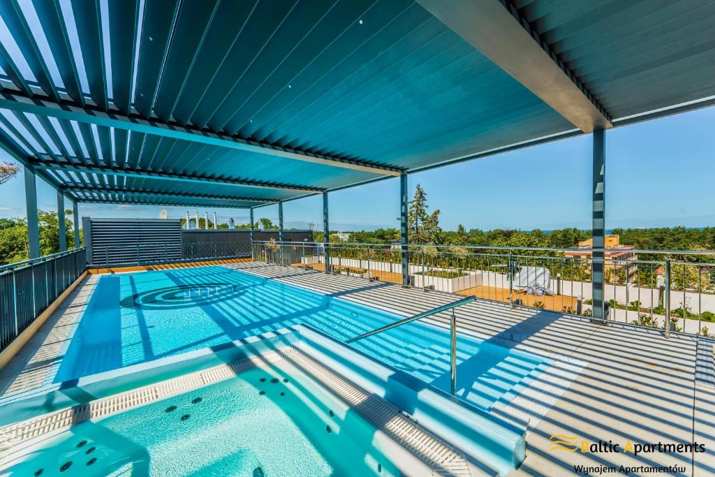 a large swimming pool on the top of a building at Seaside Garden Apartments & Wellness by Baltic Apartments in Świnoujście