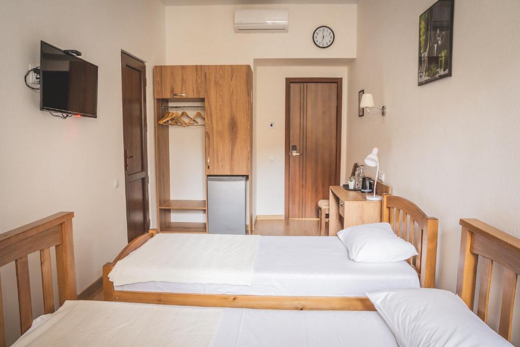 Postel nebo postele na pokoji v ubytování HH Hotel