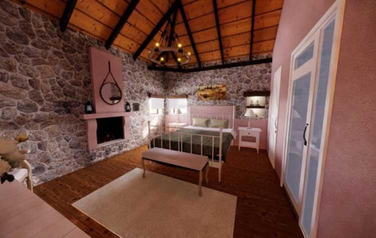 ein Schlafzimmer mit einem Bett und einem Kamin in einem Zimmer in der Unterkunft Neromilos Monastiraki Vonitsas in Monastirákion