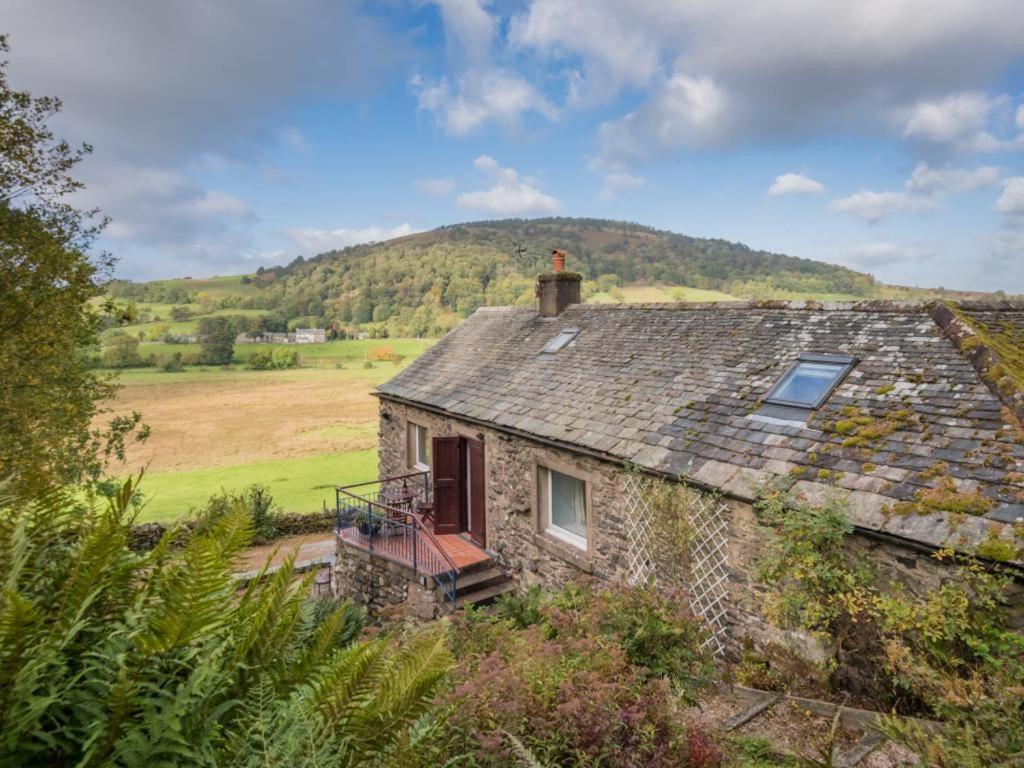 an old stone house with a window and a roof at 1 Bed in Matterdale SZ222 in Watermillock