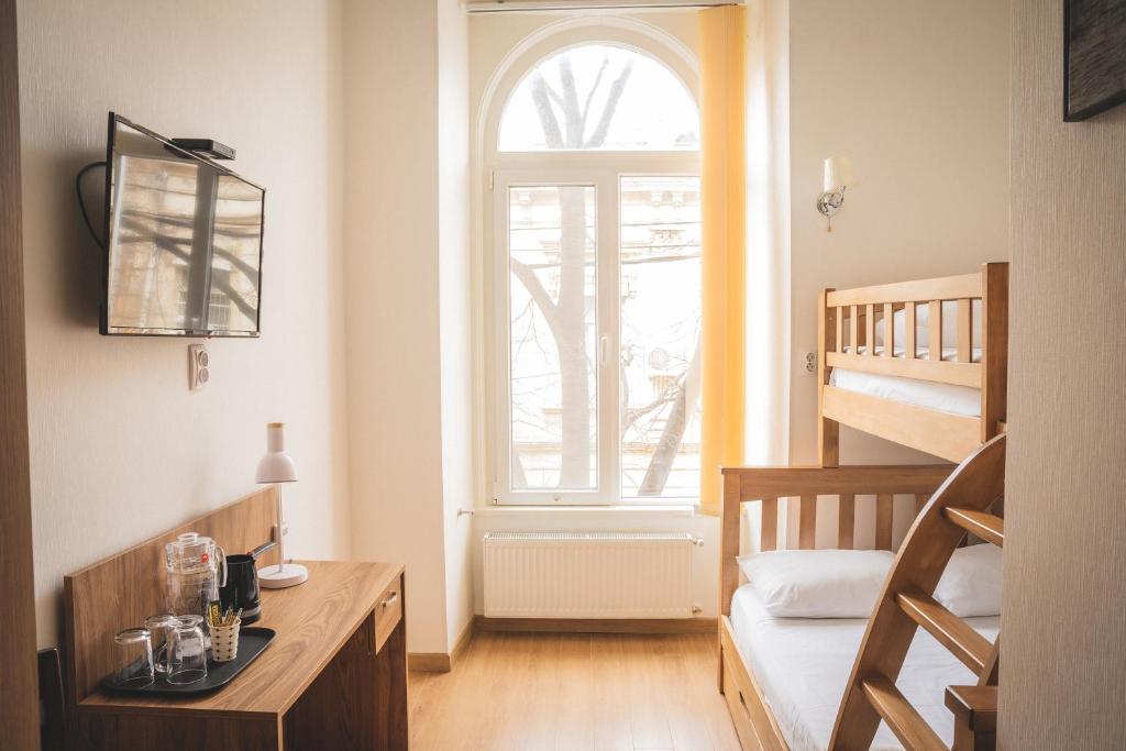 Postel nebo postele na pokoji v ubytování HH Hotel