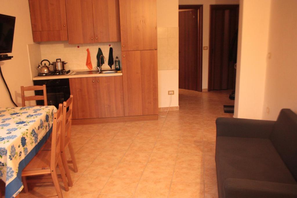 Kuchyň nebo kuchyňský kout v ubytování Lorica Apartment Residence LagoSila