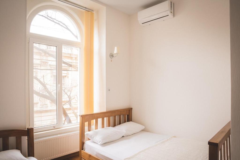 Postel nebo postele na pokoji v ubytování HH Hotel