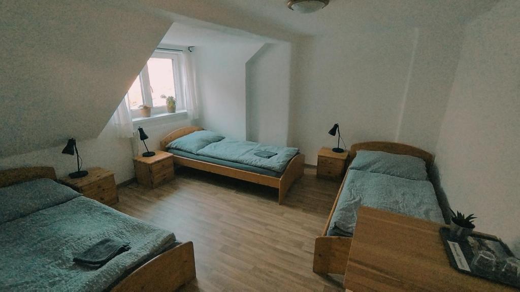 Postel nebo postele na pokoji v ubytování Penzion Jizera Malá Skála