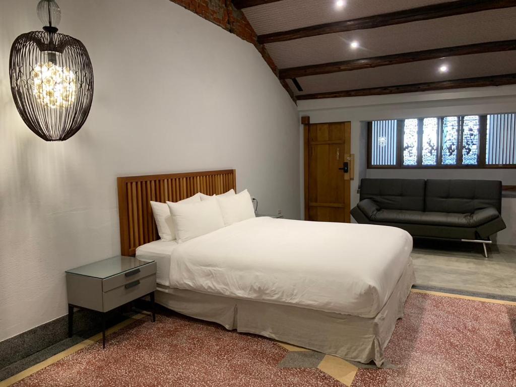 Postel nebo postele na pokoji v ubytování 璿 旅 Syuan Hotel