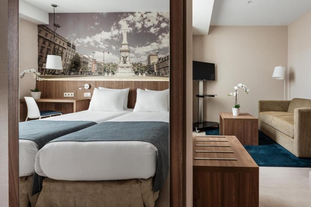 A room combining twin beds with a separate sitting area.