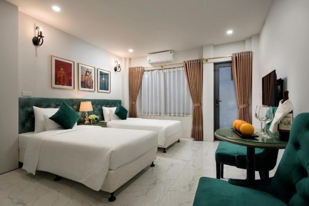 Postel nebo postele na pokoji v ubytování Gatsby Central Hotel Hanoi