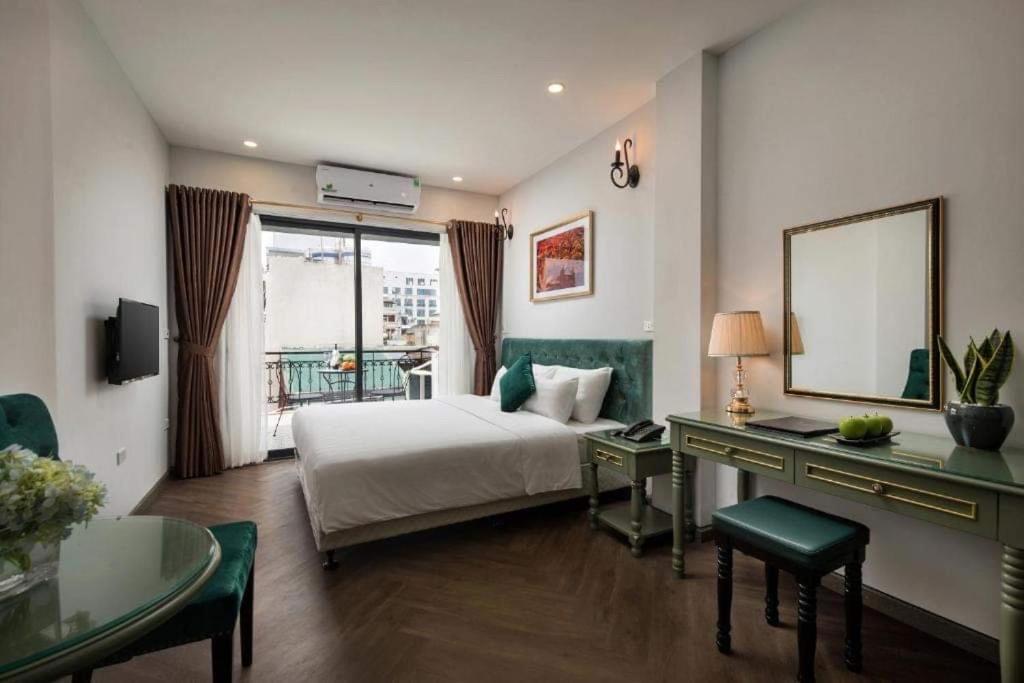 Postel nebo postele na pokoji v ubytování Gatsby Central Hotel Hanoi