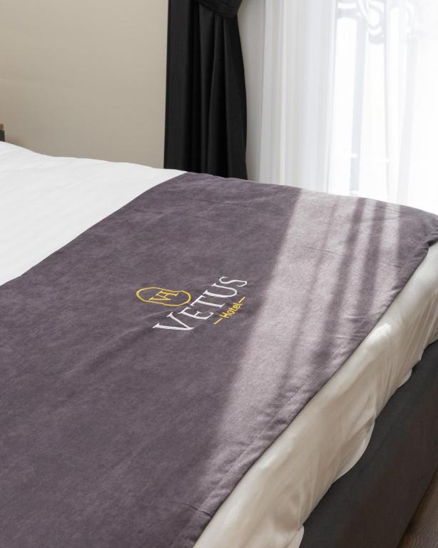 Postel nebo postele na pokoji v ubytování Vetus Hotel