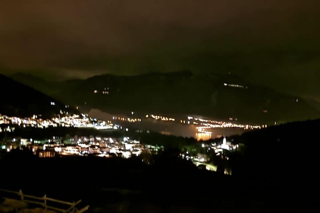 a view of a city at night with lights at Trento, Monte Bondone, casa tipica di montagna in Norge