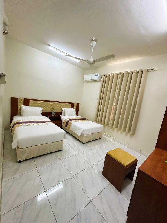 Postel nebo postele na pokoji v ubytování Bahla Jewel Hotel Apartments