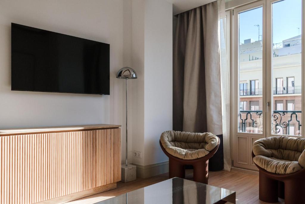 TV a/nebo společenská místnost v ubytování Apartamentos Soho Boutique Hoy No Me Puedo Levantar