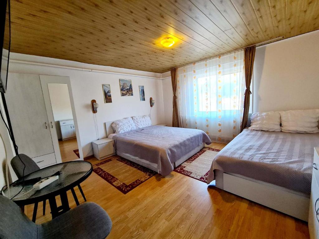 Postel nebo postele na pokoji v ubytování Vila Giulia Voineasa