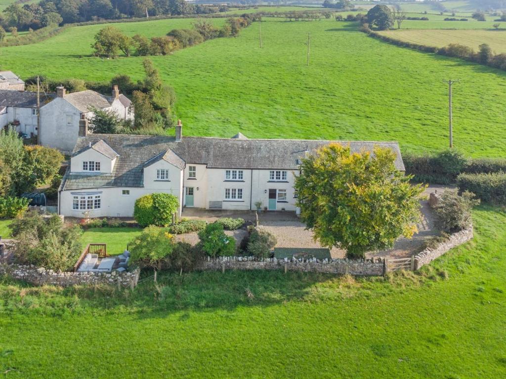 an aerial view of a house in a field at 5 Bed in Bassenthwaite 89496 in Torpenhow