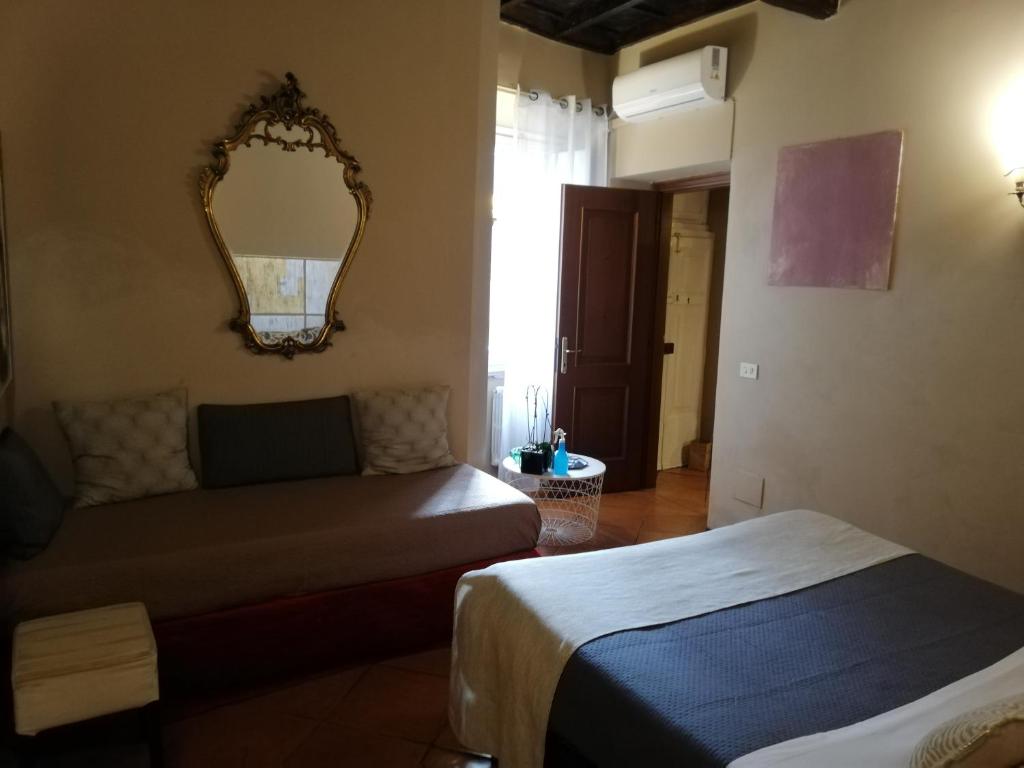 A bed or beds in a room at Apartments Campo de Fiori