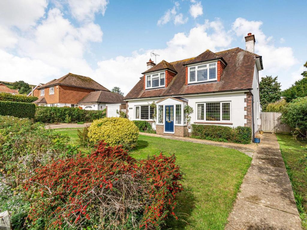 a white house with a blue door at 3 Bed in Alfriston 89657 in Alfriston