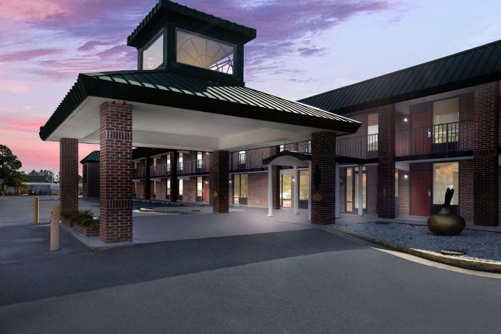 a rendering of a building with a clock tower at Quality Inn & Suites Vidalia in Vidalia