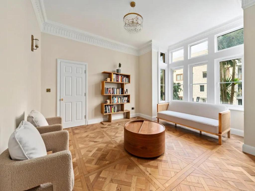 a living room with a couch and a coffee table at Pass the Keys Modern and luxury London house in London