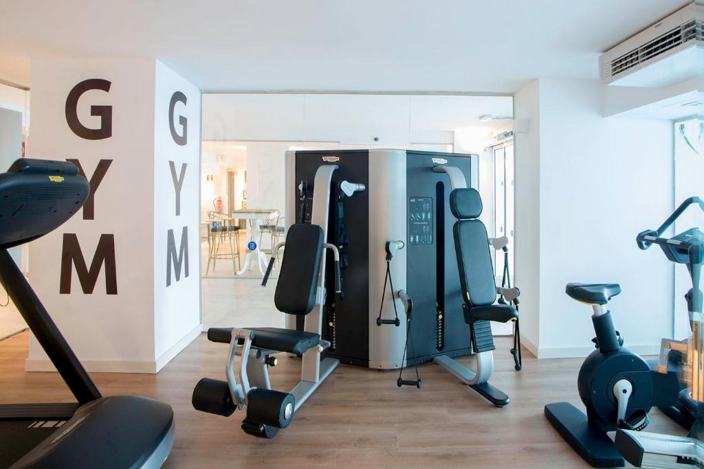 a gym with treadmills and exercise equipment in a room at Spirit Hotel Benalmadena Beach in Benalmádena