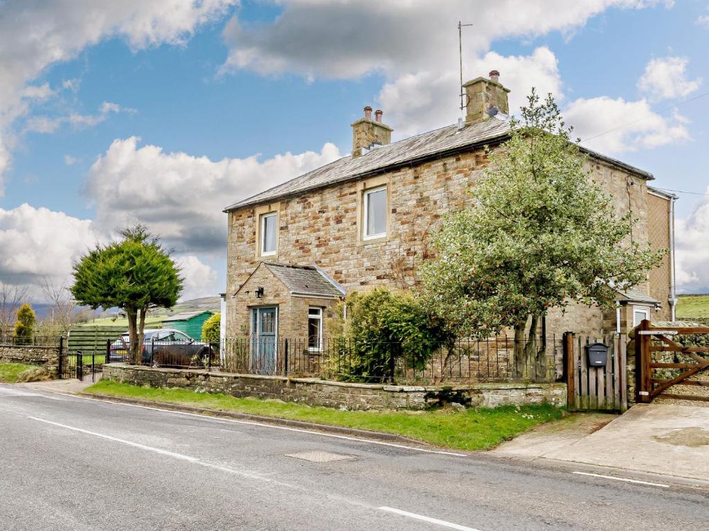 an old stone house on the side of the road at 3 Bed in Alston 89994 in Slaggyford