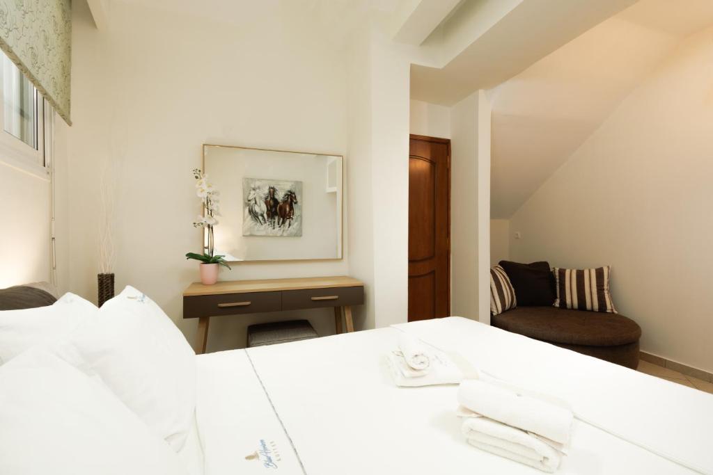 Postel nebo postele na pokoji v ubytování Blue Horizon Suites