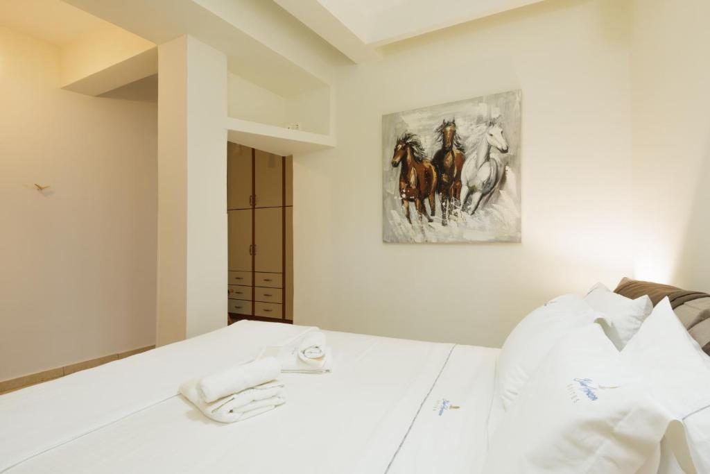 Postel nebo postele na pokoji v ubytování Blue Horizon Suites