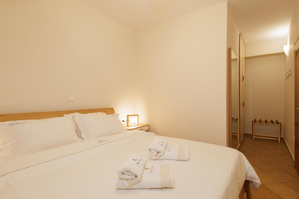 Postel nebo postele na pokoji v ubytování Blue Horizon Suites