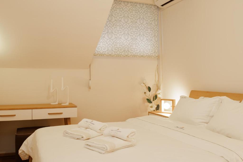 Postel nebo postele na pokoji v ubytování Blue Horizon Suites