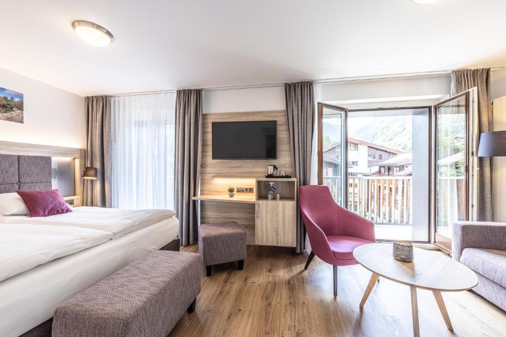 Postel nebo postele na pokoji v ubytování Hotel Bristol