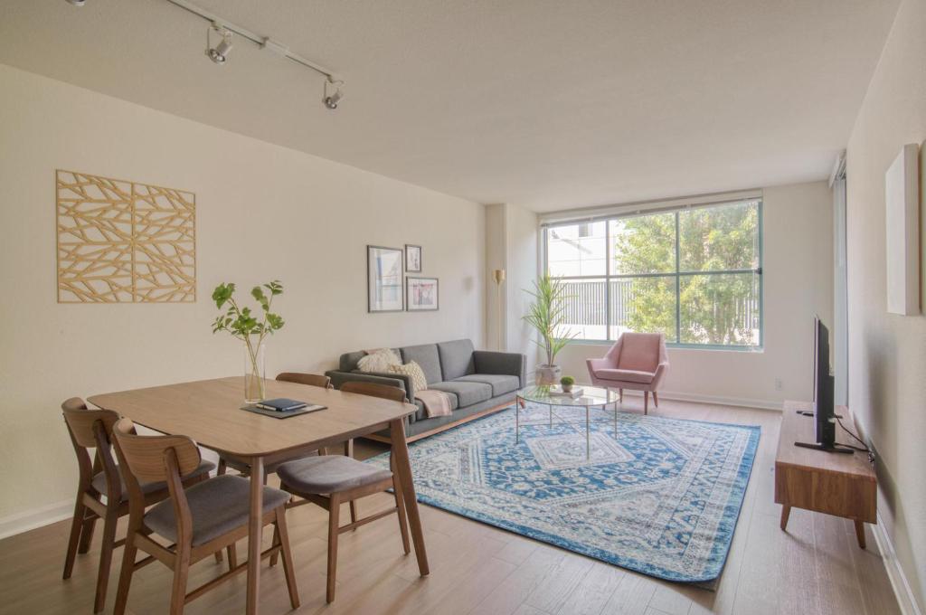 a living room with a table and a couch at South Beach 1br w on-site shops restaurants SFO-1659 in San Francisco