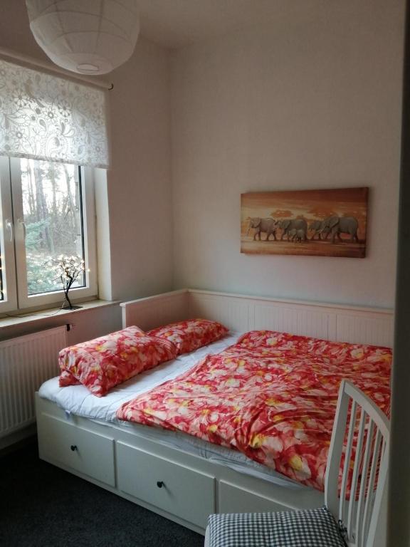 a bed in a bedroom with at Ferienwohnung Puttenusenhof in Klausdorf Brandenburg