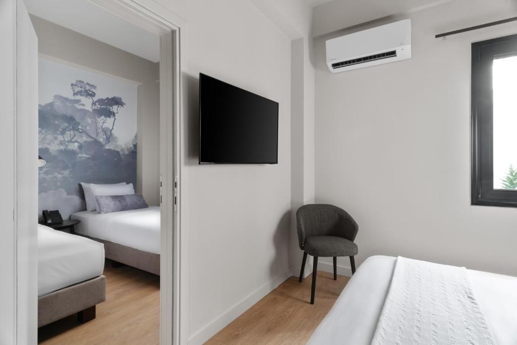 Postel nebo postele na pokoji v ubytování Azur Hotel Volos
