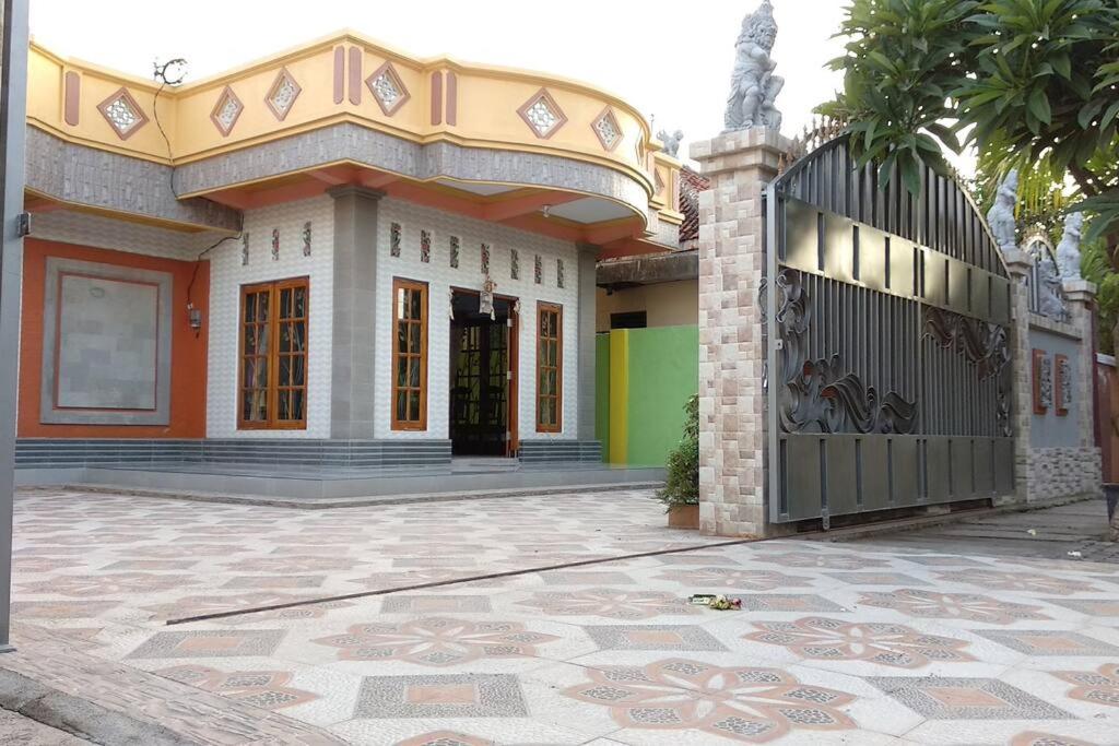 a building with a gate in front of it at Private Bali Artifac GuestHouse in Singaraja