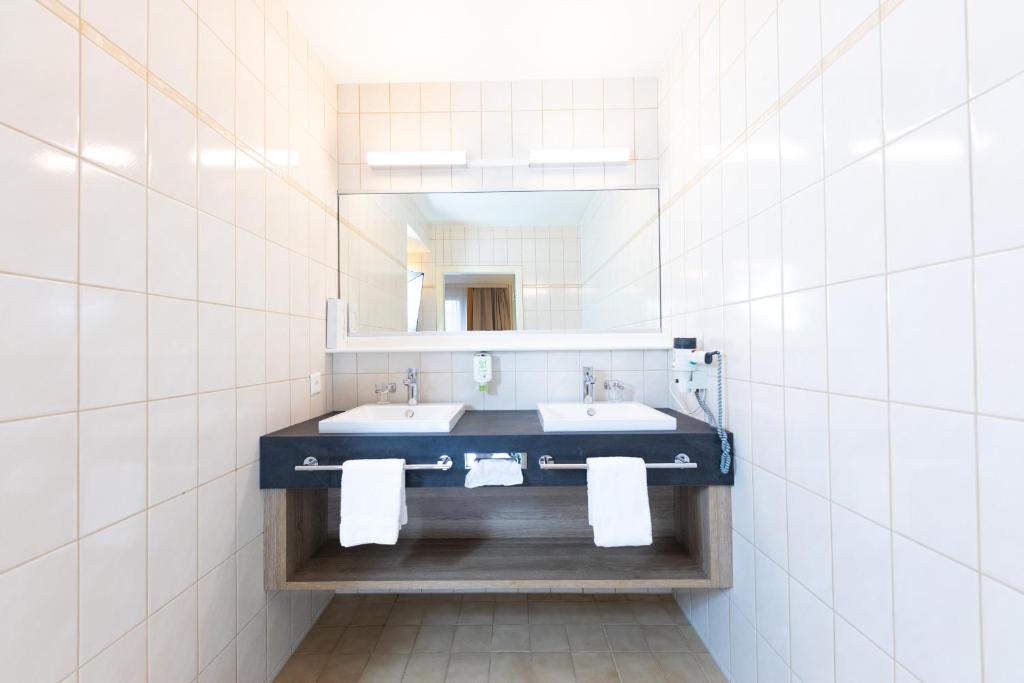 Postel nebo postele na pokoji v ubytování Hotel Alfa