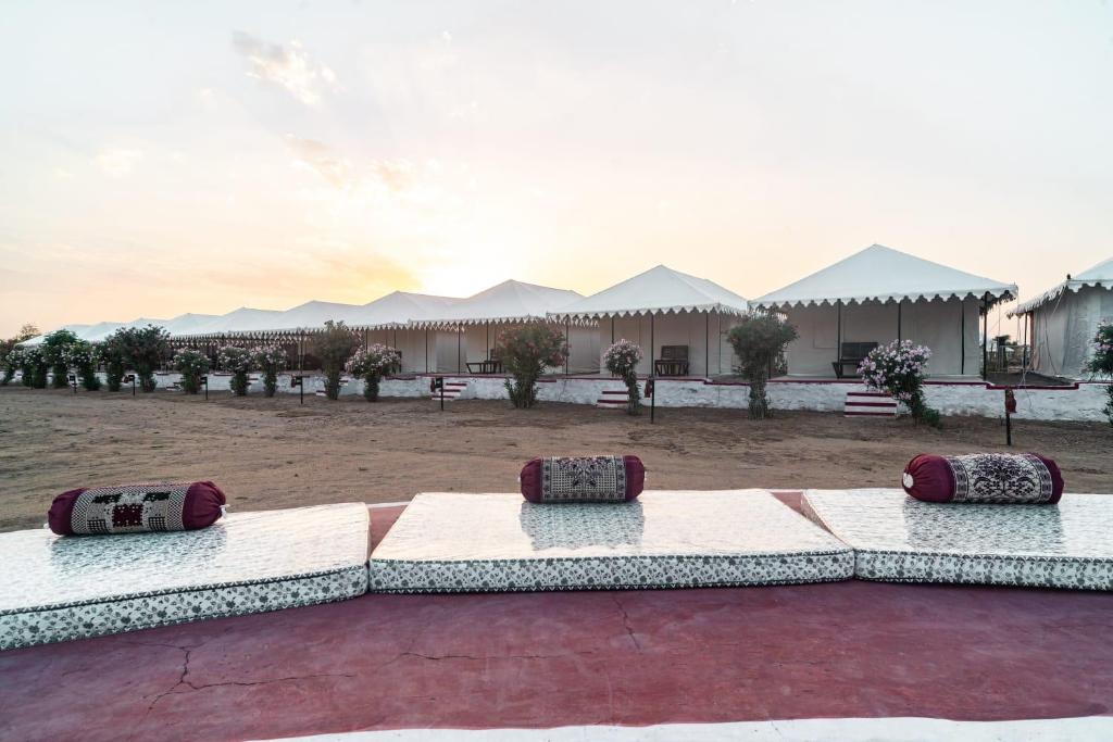 a group of pillows sitting on a patio at ARMAN DESERT RESORT in Sām