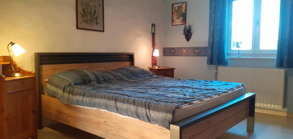 Postel nebo postele na pokoji v ubytování l'Heure bleue