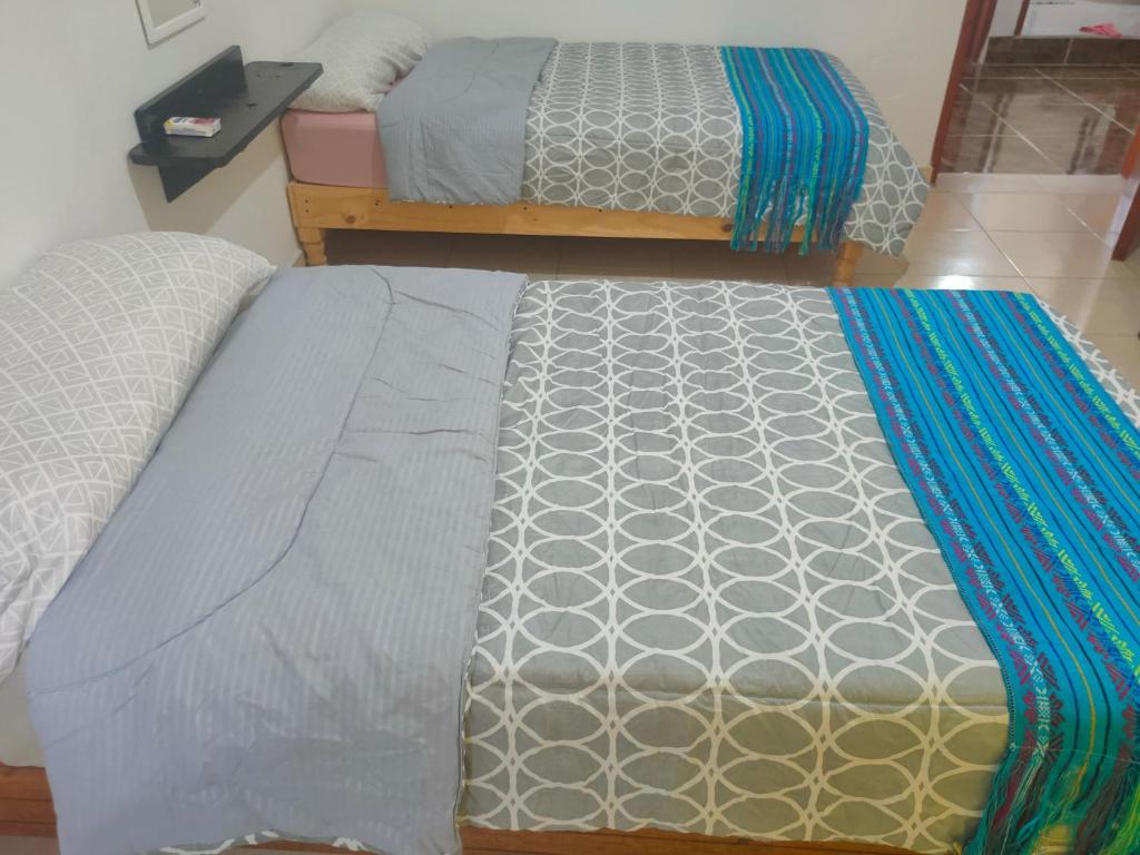 Postel nebo postele na pokoji v ubytování CASA CORAZA