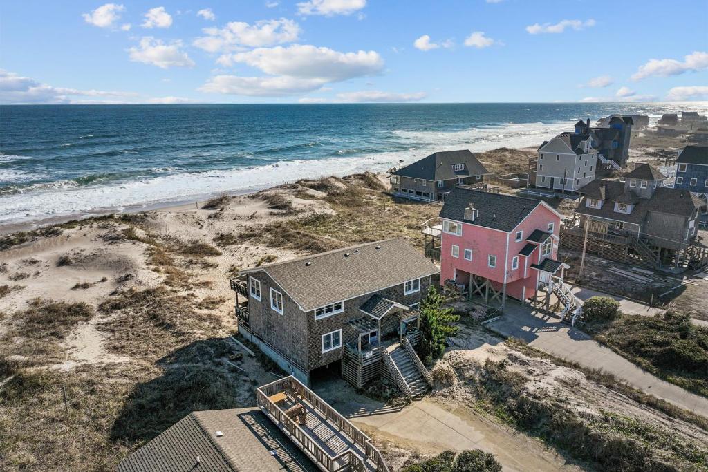 an aerial view of a house on the beach at 7019 - Sara's Sea Breeze by Resort Realty in Rodanthe