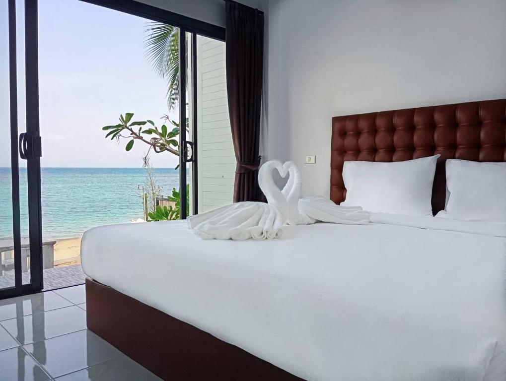 Postel nebo postele na pokoji v ubytování March Samui Resort