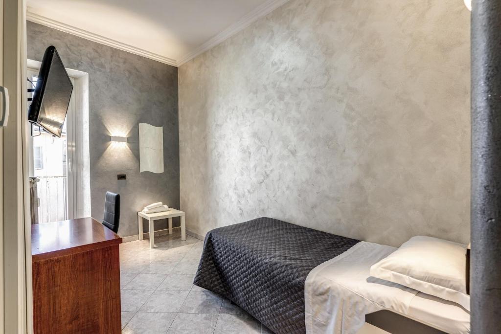 Postel nebo postele na pokoji v ubytování Hotel Planet