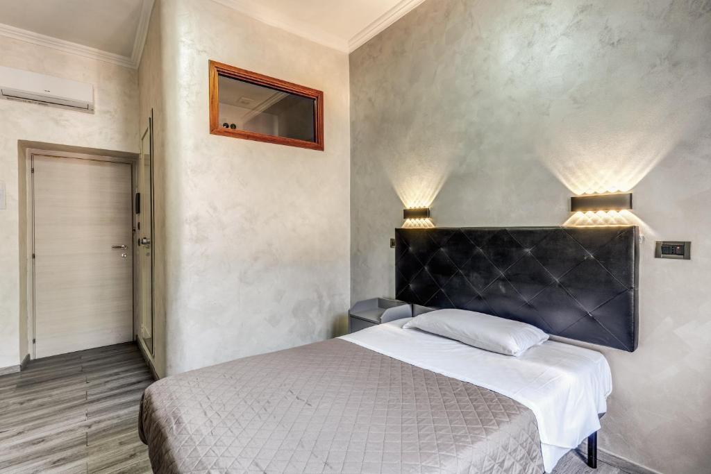 Postel nebo postele na pokoji v ubytování Hotel Planet