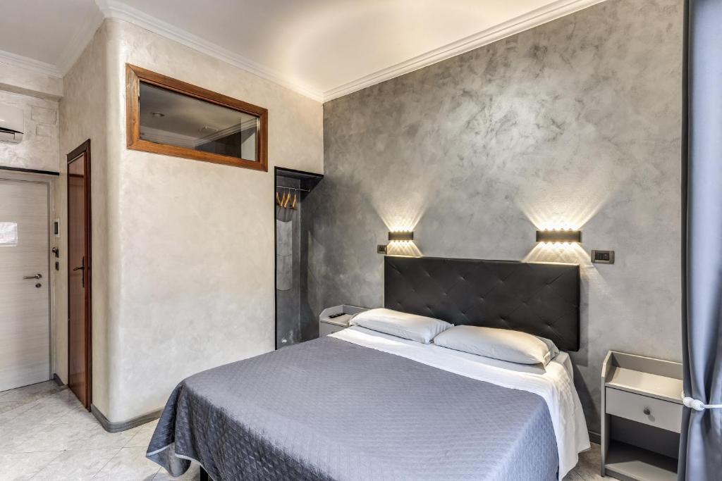 Postel nebo postele na pokoji v ubytování Hotel Planet